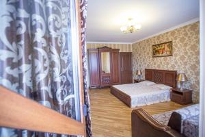 Postel nebo postele na pokoji v ubytování Goldenluxe