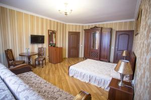 TV a/nebo společenská místnost v ubytování Goldenluxe