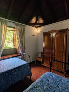 A bed or beds in a room at Masca - Casa Rural Morrocatana - Tenerife ONLY ADULTS