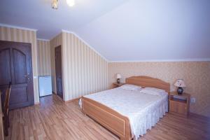Postel nebo postele na pokoji v ubytování Goldenluxe