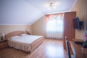 Postel nebo postele na pokoji v ubytování Goldenluxe