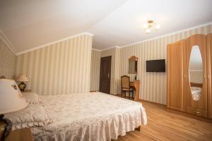 Postel nebo postele na pokoji v ubytování Goldenluxe