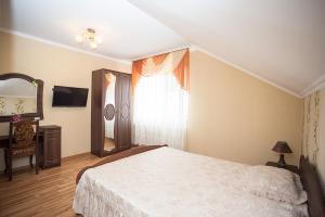 Postel nebo postele na pokoji v ubytování Goldenluxe