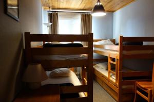 Postel nebo postele na pokoji v ubytování Résidence Eden - APPARTEMENT ALPE D'HUEZ VIEL ALPE MAE-2821