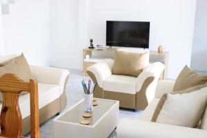 Télévision ou salle de divertissement dans l'établissement Garden Suite