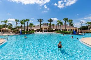 a group of people in a swimming pool at a resort at Mickey Mouse #104 in Orlando