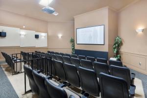 a lecture room with black chairs and a screen at Mickey Mouse #104 in Orlando +37 photos
