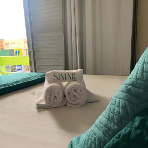 Postel nebo postele na pokoji v ubytování Simar Hotel