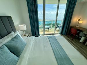 Voodi või voodid majutusasutuse Balcony Ocean View ! WiFi - Pool - Gym - Parking toas