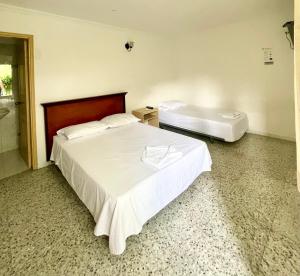Postel nebo postele na pokoji v ubytování Hotel Casa Fátima
