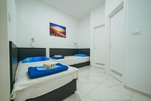 Posteľ alebo postele v izbe v ubytovaní Apartments Lovre