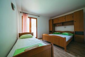 Posteľ alebo postele v izbe v ubytovaní Apartments Lovre