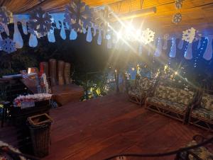 a room with snow mittens hanging from the ceiling at River Glamping Melgar in Melgar