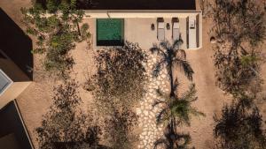 an overhead view of a house with palm trees at Salara Boutique Villas Todos Santos in Todos Santos +53 photos