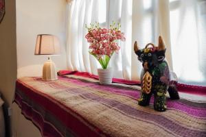 Voodi või voodid majutusasutuse WARM AND CENTRAL HOUSE WITH SPECTACULAR VIEW OF CUSCO toas