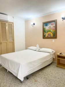 Postel nebo postele na pokoji v ubytování Hotel Casa Fátima