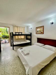 Postel nebo postele na pokoji v ubytování Hotel Casa Fátima