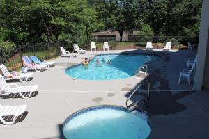 a group of people playing in a swimming pool at Gatlinburg Chateau Condo 510 in Gatlinburg