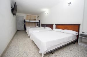 Postel nebo postele na pokoji v ubytování Hotel Casa Fátima