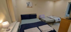 Ένα ή περισσότερα κρεβάτια σε δωμάτιο στο Romford Lodge