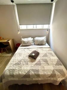 Ένα ή περισσότερα κρεβάτια σε δωμάτιο στο Apartamento/Estúdio no Leblon. +11 φωτογραφίες