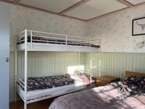 a bedroom with two bunk beds in a room at 10 person holiday home in BÄCKEFORS in Bäckefors
