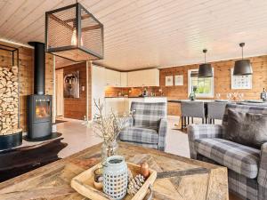 a living room with a table and a fireplace at 9 person holiday home in Rauland in Rauland