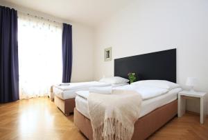 Postel nebo postele na pokoji v ubytování Prague Central Residence
