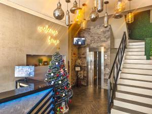 a christmas tree in the lobby of a hotel at Voss Condominium in Manila