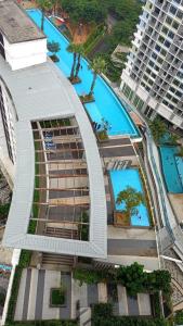 an overhead view of a building with several swimming pools at Spacious i-City Studio home 3 Beds by Nuriman in Shah Alam