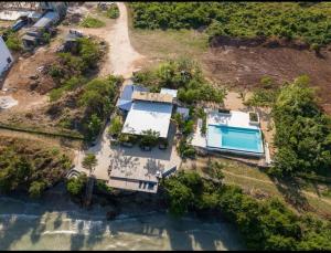 an aerial view of a house with a swimming pool at Rest Studio Apartment in Dambani