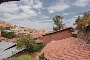 a view of a village with red roofs at BEAUTIFUL, SPACIOUS & COZY HOUSE LOCATED IN THE HEART OF CUSCO in Cusco