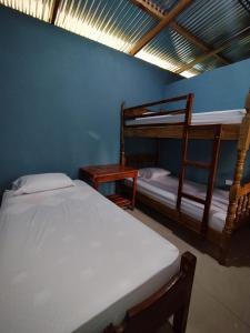 Ένα ή περισσότερα κρεβάτια σε δωμάτιο στο Hostel El Quino Ometepe
