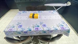 a table with purple flowers painted on it at Lylinz Dy Cermai in Pasir Gudang +3 photos