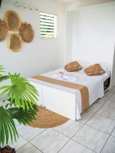 Vuode tai vuoteita majoituspaikassa SWILODGE VUE SUR MER ! Petit Déjeuner et Location de voiture possible