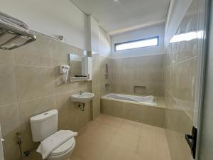 Koupelna v ubytování Graha Socio Hotel Nusa Dua Bali
