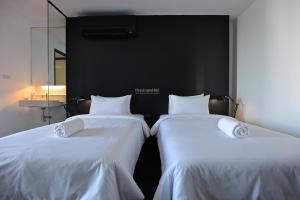 Postel nebo postele na pokoji v ubytování BED Nimman - Adults Only