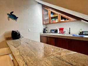 a kitchen with a counter top and a sink at Casitas Punta Arenas #3 in La Ventana
