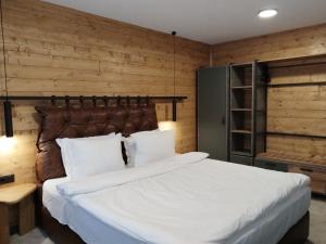 Postel nebo postele na pokoji v ubytování Iglika Hotel & Villas Borovets