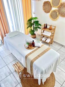 Vuode tai vuoteita majoituspaikassa SWILODGE VUE SUR MER ! Petit Déjeuner et Location de voiture possible