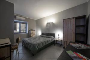 Säng eller sängar i ett rum på Il Taschino Suite