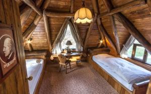 a bedroom with two beds in a wooden cabin at Chimborazo Lodge in Chimborazo