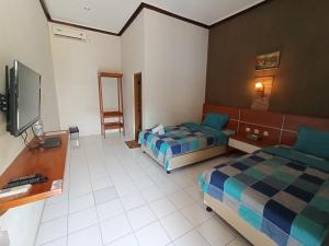 Yokima Beach Hotel TV 또는 엔터테인먼트 센터