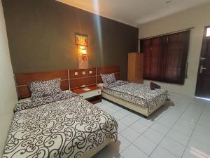 Yokima Beach Hotel 객실 침대