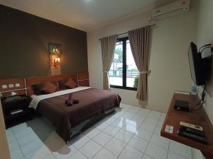 Yokima Beach Hotel 객실 침대