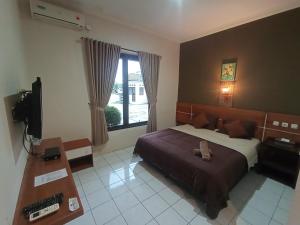 Yokima Beach Hotel 객실 침대