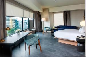 A bed or beds in a room at Fairfield by Marriott Lima Miraflores