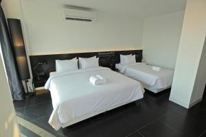 Postel nebo postele na pokoji v ubytování BED Nimman - Adults Only