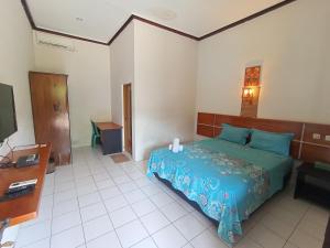 Yokima Beach Hotel 객실 침대