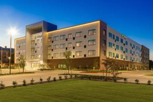 a large building with a lawn in front of it at Element by Marriott Dallas Richardson in Richardson